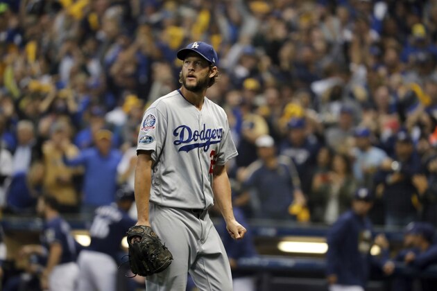 Los Angeles Dodgers starting pitcher Clayton Kershaw (22) walks after being removed from the game during the fourth inning of Game 1 of the National League Championship Series baseball game against the Milwaukee Brewers Friday, Oct. 12, 2018, in Milwaukee. (AP Photo/Jeff Roberson)