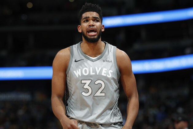 Minnesota Timberwolves center Karl-Anthony Towns leaves the court after he fouled out in the second half of the team's NBA basketball game against the Denver Nuggets on Thursday, April 5, 2018, in Denver. The Nuggets won 100-96. (AP Photo/David Zalubowski)