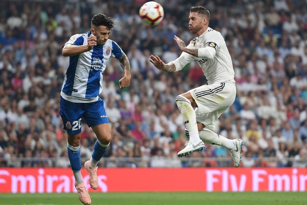 MADRID, SPAIN - SEPTEMBER 22:  Sergio Ramos (right) of Real Madrid is tackled by Mario Hermoso of RCD Espanyol during the La Liga match between Real Madrid CF and RCD Espanyol at Estadio Santiago Bernabeu on September 22, 2018 in Madrid, Spain. (Photo by Denis Doyle/Getty Images,)