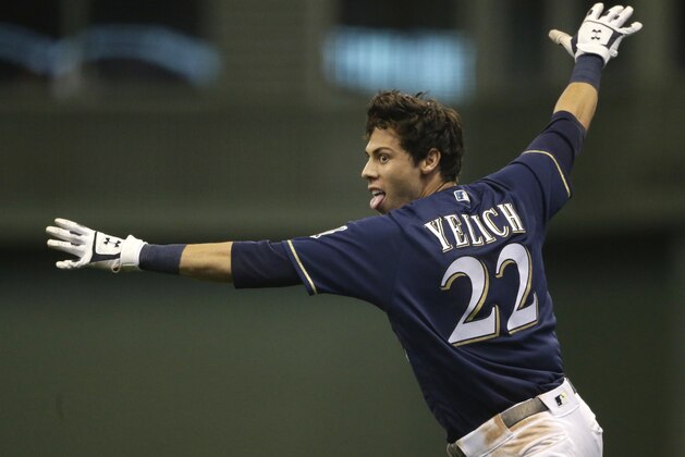 Milwaukee Brewers' Christian Yelich reacts after driving in the game winning run during the ninth inning of a baseball game against the Chicago Cubs Monday, Sept. 3, 2018, in Milwaukee. The Brewers won 4-3.(AP Photo/Aaron Gash)
