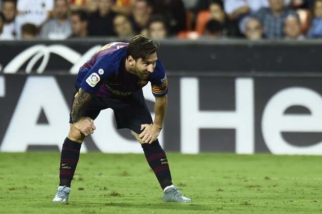Barcelona's Argentinian forward Lionel Messi bends over during the Spanish league football match between Valencia CF and FC Barcelona at the Mestalla stadium in Valencia on October 7, 2018. (Photo by JOSE JORDAN / AFP)        (Photo credit should read JOSE JORDAN/AFP/Getty Images)