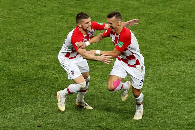 MOSCOW, RUSSIA - JULY 15:  Ivan Perisic of Croatia celebrates after scoring his side's first goal, with team mate Ante Rebic during the 2018 FIFA World Cup Final between France and Croatia at Luzhniki Stadium on July 15, 2018 in Moscow, Russia.  (Photo by Catherine Ivill/Getty Images)
