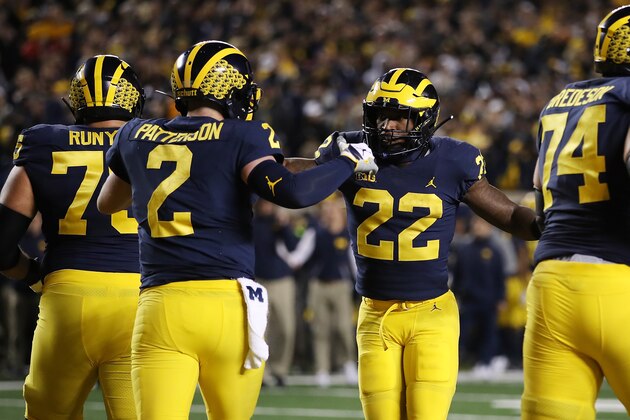ANN ARBOR, MI - OCTOBER 13: Karan Higdon #22 of the Michigan Wolverines celebrates a first half touchdown with Shea Patterson #2 of the Michigan Wolverines while playing the Wisconsin Badgers on October 13, 2018 at Michigan Stadium in Ann Arbor, Michigan. (Photo by Gregory Shamus/Getty Images)