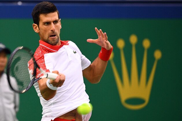 Novak Djokovic of Serbia hits a return against Borna Coric of Croatia in their men's singles final match at the Shanghai Masters tennis tournament on October 14, 2018. (Photo by Johannes EISELE / AFP)        (Photo credit should read JOHANNES EISELE/AFP/Getty Images)