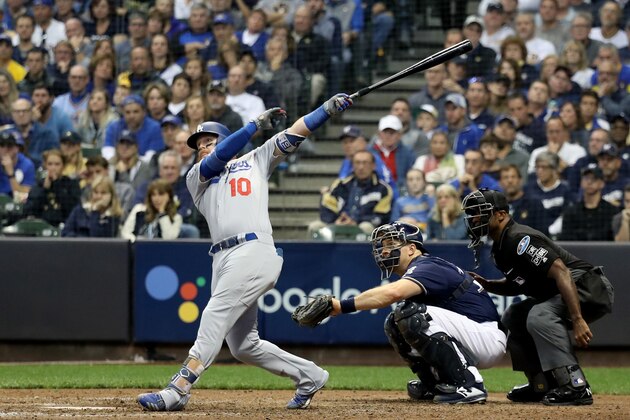 MILWAUKEE, WI - OCTOBER 13:  Justin Turner #10 of the Los Angeles Dodgers hits a two run home run against Jeremy Jeffress #32 of the Milwaukee Brewers during the eighth inning in Game Two of the National League Championship Series at Miller Park on October 13, 2018 in Milwaukee, Wisconsin.  (Photo by Rob Carr/Getty Images)