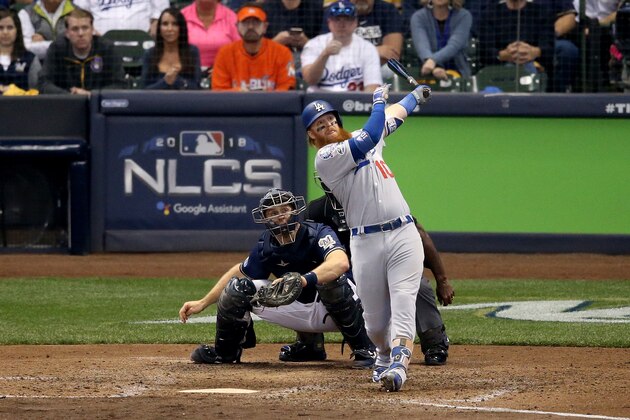 MILWAUKEE, WI - OCTOBER 13:  Justin Turner #10 of the Los Angeles Dodgers hits a two run home run against Jeremy Jeffress #32 of the Milwaukee Brewers during the eighth inning in Game Two of the National League Championship Series at Miller Park on October 13, 2018 in Milwaukee, Wisconsin.  (Photo by Dylan Buell/Getty Images)