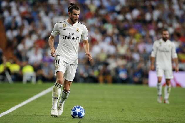 Real midfielder Gareth Bale vies the ball during a Group G Champions League soccer match between Real Madrid and Roma at the Santiago Bernabeu stadium in Madrid, Spain, Wednesday Sept. 19, 2018. (AP Photo/Paul White)