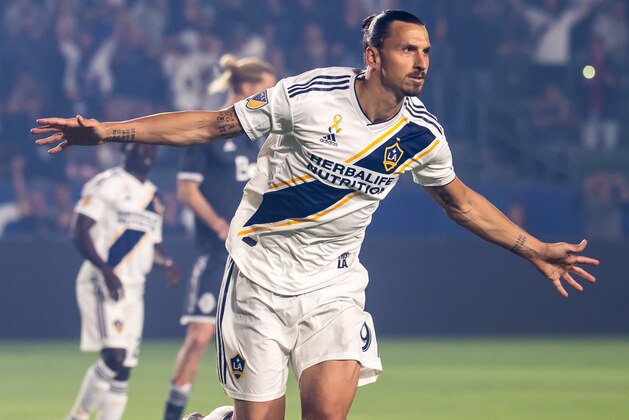 CARSON, CA - SEPTEMBER 29: Zlatan Ibrahimovic #9 of Los Angeles Galaxy celebrates his penalty kick goal during the Los Angeles Galaxy's MLS match against Vancouver Whitecaps at the StubHub Center on September 29, 2018 in Carson, California.  The Los Angeles Galaxy won the match 3-0 (Photo by Shaun Clark/Getty Images)