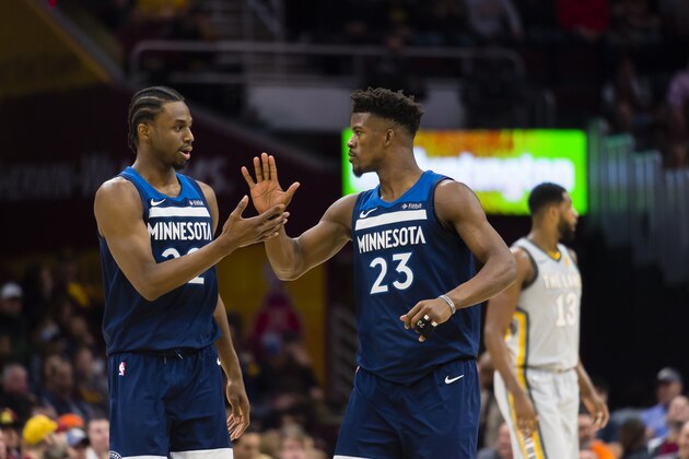 CLEVELAND, OH - FEBRUARY 7: Andrew Wiggins #22 and Jimmy Butler #23 of the Minnesota Timberwolves celebrate after scoring during the second half against the Cleveland Cavaliers at Quicken Loans Arena on February 7, 2018 in Cleveland, Ohio. The Cavaliers defeated the Timberwolves 140-138 in overtime. NOTE TO USER: User expressly acknowledges and agrees that, by downloading and or using this photograph, User is consenting to the terms and conditions of the Getty Images License Agreement. (Photo by Jason Miller/Getty Images)