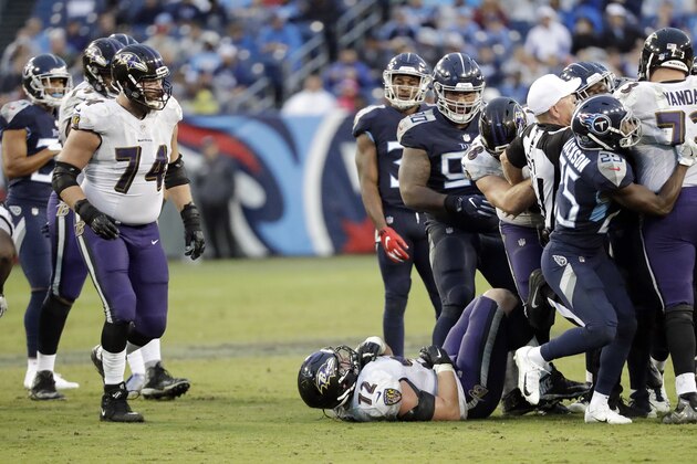 Baltimore Ravens guard Alex Lewis (72) lies on the ground after being injured in the second half of an NFL football game between the Ravens and the Tennessee Titans Sunday, Oct. 14, 2018, in Nashville, Tenn. (AP Photo/James Kenney)
