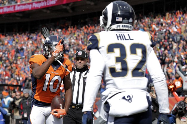 Denver Broncos wide receiver Emmanuel Sanders (10) taunts Los Angeles Rams cornerback Troy Hill (32) for a penalty during the first half of an NFL football game, Sunday, Oct. 14, 2018, in Denver. (AP Photo/Joe Mahoney)