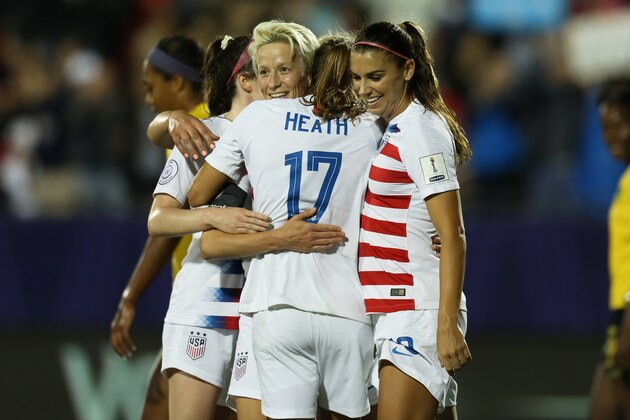 FRISCO, TX - OCTOBER 14: Megan Rapinoe of USA celebrates with teammates after scoring a goal during the semifinal match between Jamaica and United States as part of CONCACAF Women's Championship at Toyota Stadium on October 14, 2018 in Frisco, Texas. (Photo by Omar Vega/Getty Images)