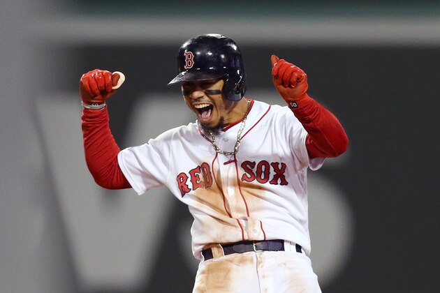 BOSTON, MA - OCTOBER 14:  Mookie Betts #50 of the Boston Red Sox celebrates his two-run double during the eighth inning against the Houston Astros in Game Two of the American League Championship Series at Fenway Park on October 14, 2018 in Boston, Massachusetts.  (Photo by Maddie Meyer/Getty Images)