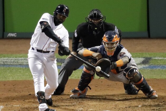 Boston Red Sox's Jackie Bradley Jr. hits a three RBI-double against the Houston Astros during the third inning in Game 2 of a baseball American League Championship Series on Sunday, Oct. 14, 2018, in Boston. (AP Photo/Elise Amendola)