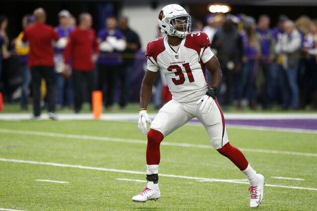 Arizona Cardinals running back David Johnson runs on the field before an NFL football game against the Minnesota Vikings, Sunday, Oct. 14, 2018, in Minneapolis. (AP Photo/Jim Mone)