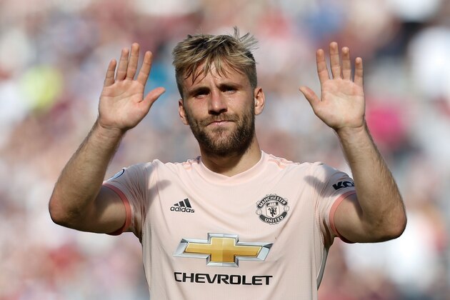 Manchester United's English defender Luke Shaw applauds at the end of the English Premier League football match between West Ham United and Manchester United at The London Stadium, in east London on September 29, 2018. (Photo by Ian KINGTON / AFP) / RESTRICTED TO EDITORIAL USE. No use with unauthorized audio, video, data, fixture lists, club/league logos or 'live' services. Online in-match use limited to 120 images. An additional 40 images may be used in extra time. No video emulation. Social media in-match use limited to 120 images. An additional 40 images may be used in extra time. No use in betting publications, games or single club/league/player publications. /         (Photo credit should read IAN KINGTON/AFP/Getty Images)
