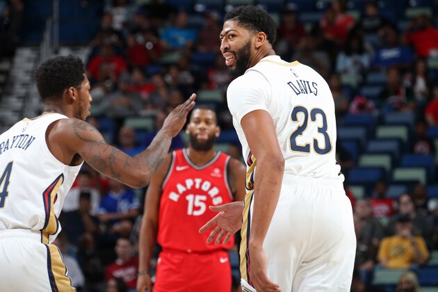 NEW ORLEANS, LA - OCTOBER 11: Anthony Davis #23 of the New Orleans Pelicans shakes teammates hands during a pre-season game against the Toronto Raptors on October 11, 2018 at Smoothie King Center in New Orleans, Louisiana. NOTE TO USER: User expressly acknowledges and agrees that, by downloading and or using this Photograph, user is consenting to the terms and conditions of the Getty Images License Agreement. Mandatory Copyright Notice: Copyright 2018 NBAE (Photo by Layne Murdoch Jr./NBAE via Getty Images)