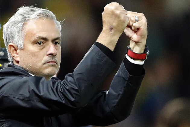 Manchester United head coach Jose Mourinho gestures after his team won the English Premier League soccer match between Watford and Manchester United at Vicarage Road stadium in Watford, England, Saturday, Sept. 15, 2018.(AP Photo/Frank Augstein)