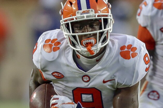 COLLEGE STATION, TX - SEPTEMBER 08:  Travis Etienne #9 of the Clemson Tigers runs with the ball against the Texas A&M Aggies at Kyle Field on September 8, 2018 in College Station, Texas. (Photo by Bob Levey/Getty Images)