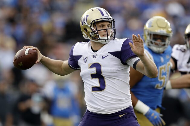 Washington quarterback Jake Browning looks for a receiver during the first half of an NCAA college football game against UCLA on Saturday, Oct. 6, 2018, in Pasadena, Calif. (AP Photo/Marcio Jose Sanchez)