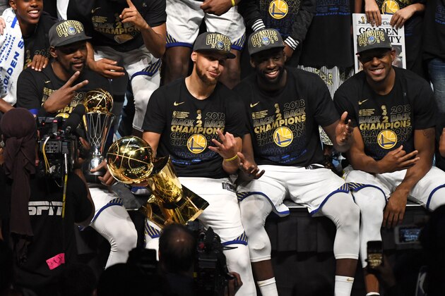 CLEVELAND, OH - JUNE 8:  Kevin Durant, Stephen Curry, Draymond Green and Andre Iguodala pose for a photo after defeating the Cleveland Cavaliers during Game Four of the 2018 NBA Finals on June 8, 2018 at Quicken Loans Arena in Cleveland, Ohio. NOTE TO USER: User expressly acknowledges and agrees that, by downloading and or using this Photograph, user is consenting to the terms and conditions of the Getty Images License Agreement. Mandatory Copyright Notice: Copyright 2018 NBAE (Photo by Garrett Ellwood/NBAE via Getty Images)
