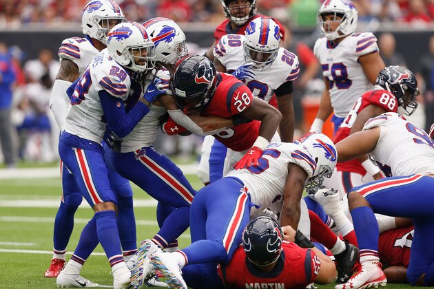 HOUSTON, TX - OCTOBER 14:  Alfred Blue #28 of the Houston Texans rushes the ball tackled by Tremaine Edmunds #49 of the Buffalo Bills in the second quarter at NRG Stadium on October 14, 2018 in Houston, Texas.  (Photo by Bob Levey/Getty Images)