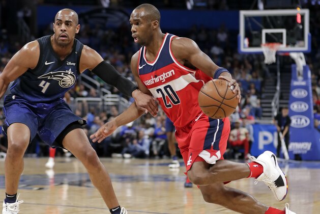 Washington Wizards' Jodie Meeks (20) drives around Orlando Magic's Arron Afflalo (4) during the first half of an NBA basketball game Wednesday, April 11, 2018, in Orlando, Fla. (AP Photo/John Raoux)