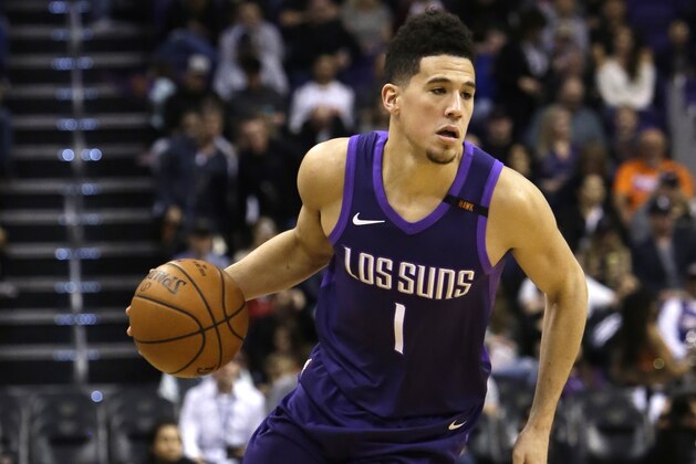 Phoenix Suns guard Devin Booker (1) in the first half during an NBA basketball game against the New York Knicks, Friday, Jan. 26, 2018, in Phoenix. (AP Photo/Rick Scuteri)