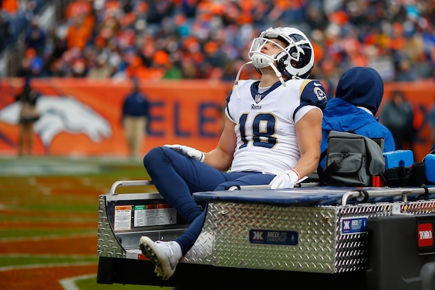 DENVER, CO - OCTOBER 14:  wide receiver Cooper Kupp #18 of the Los Angeles Rams is carted off the field with a knee injury during the second quarter against the Denver Broncos at Broncos Stadium at Mile High on October 14, 2018 in Denver, Colorado. (Photo by Justin Edmonds/Getty Images)