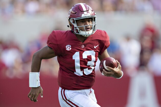 TUSCALOOSA, AL - SEPTEMBER 22:  Tua Tagovailoa #13 of the Alabama Crimson Tide runs the ball during a game against the Texas A&M Aggies at Bryant-Denny Stadium on September 22, 2018 in Tuscaloosa, Alabama.  The Crimson Tide defeated the Aggies 45-23.  (Photo by Wesley Hitt/Getty Images)