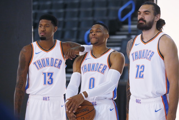 From left, Oklahoma City Thunder's Paul George (13), Russell Westbrook (0) and Steven Adams (12), pose for a photo during an NBA basketball media day in Oklahoma City, Monday, Sept. 24, 2018. (AP Photo/Sue Ogrocki)