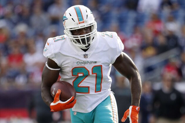 Miami Dolphins' Frank Gore runs during an NFL football game against the New England Patriots at Gillette Stadium, Sunday, Sept. 30, 2018 in Foxborough, Mass. (Winslow Townson/AP Images for Panini)