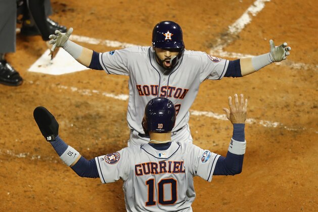 BOSTON, MA - OCTOBER 14:  Marwin Gonzalez #9 of the Houston Astros celebrates with Yuli Gurriel #10 after hitting a two-run home run in the third inning against the Boston Red Sox during Game Two of the American League Championship Series at Fenway Park on October 14, 2018 in Boston, Massachusetts.  (Photo by Omar Rawlings/Getty Images)