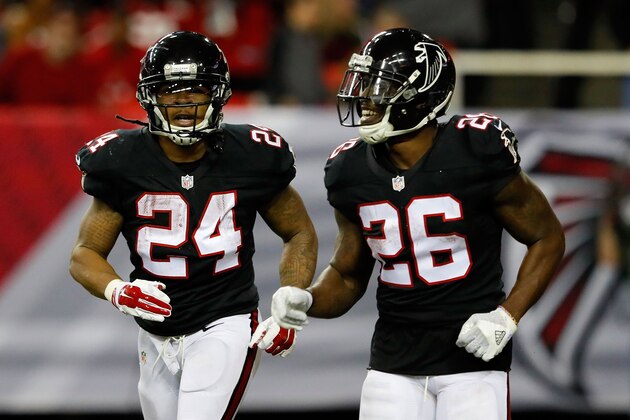 ATLANTA, GA - DECEMBER 18: Devonta Freeman #24 runs off the field with Tevin Coleman #26 of the Atlanta Falcons after scoring during the second half against the San Francisco 49ers at the Georgia Dome on December 18, 2016 in Atlanta, Georgia. (Photo by Kevin C.  Cox/Getty Images)