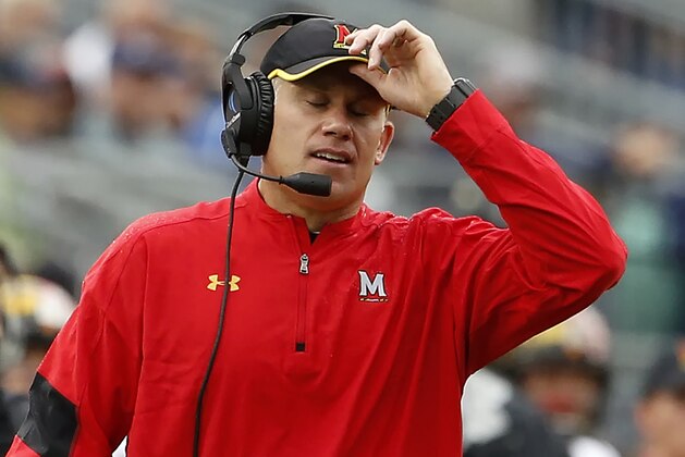 FILE - In this Oct. 8, 2016, file photo, Maryland head coach DJ Durkin reacts after Penn State scores during the second half of an NCAA college football game in State College, Pa. Durkin knew his first year at Maryland wasn't going to be easy. After absorbing a 59-3 spanking by No. 2 Michigan, the Terrapins now must prepare for sixth-ranked Ohio State. (AP Photo/Chris Knight, File)