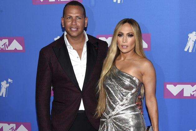 Alex Rodriguez, left, and Jennifer Lopez arrive at the MTV Video Music Awards at Radio City Music Hall on Monday, Aug. 20, 2018, in New York. (Photo by Evan Agostini/Invision/AP)