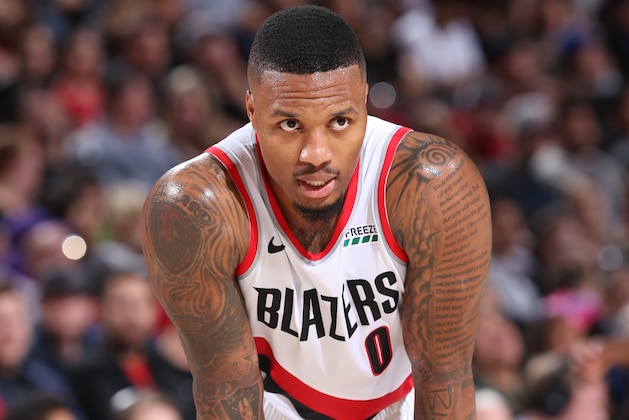 PORTLAND, OR - OCTOBER 12:  Damian Lillard #0 of the Portland Trail Blazers looks on during the game against the Sacramento Kings on October 12, 2018 at the Moda Center Arena in Portland, Oregon. NOTE TO USER: User expressly acknowledges and agrees that, by downloading and or using this photograph, user is consenting to the terms and conditions of the Getty Images License Agreement. Mandatory Copyright Notice: Copyright 2018 NBAE (Photo by Sam Forencich/NBAE via Getty Images)