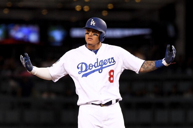 LOS ANGELES, CA - OCTOBER 15:  Manny Machado #8 of the Los Angeles Dodgers reacts after hitting a double during the ninth inning against the Milwaukee Brewers in Game Three of the National League Championship Series at Dodger Stadium on October 15, 2018 in Los Angeles, California.  (Photo by Harry How/Getty Images)