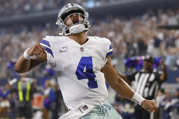 Dallas Cowboys quarterback Dak Prescott (4) celebrates after a touchdown in the first half of an NFL football game against the Jacksonville Jaguars in Arlington, Texas, Sunday, Oct. 14, 2018. (AP Photo/Ron Jenkins)