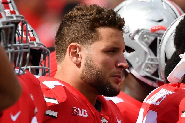 COLUMBUS, OH - SEPTEMBER 1:  Nick Bosa #97 of the Ohio State Buckeyes takes a breather on the sideline against the Oregon State Beavers at Ohio Stadium on September 1, 2018 in Columbus, Ohio. Ohio State defeated Oregon State 77-31.  (Photo by Jamie Sabau/Getty Images)