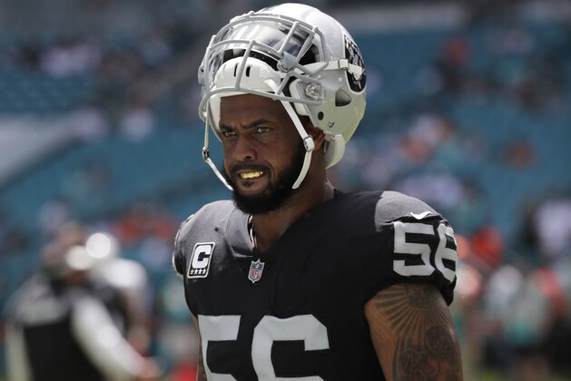 Oakland Raiders linebacker Derrick Johnson warms up before the start of an NFL football game against the Miami Dolphins, Sunday, Sept. 23, 2018 in Miami Gardens, Fla. (AP Photo/Lynne Sladky)