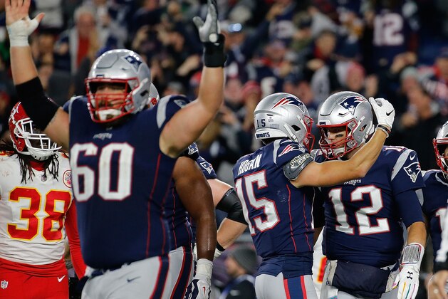 FOXBOROUGH, MA - OCTOBER 14: Tom Brady #12 of the New England Patriots his touchdown with Chris Hogan #15 of the New England Patriots in the fourth quarter against the Kansas City Chiefs at Gillette Stadium on October 14, 2018 in Foxborough, Massachusetts. (Photo by Jim Rogash/Getty Images)
