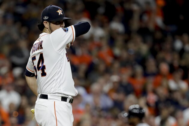 Boston Red Sox's Jackie Bradley Jr., right, rounds the bases after a grand slam off Houston Astros relief pitcher Roberto Osuna during the eighth inning in Game 3 of a baseball American League Championship Series on Tuesday, Oct. 16, 2018, in Houston. (AP Photo/David J. Phillip)