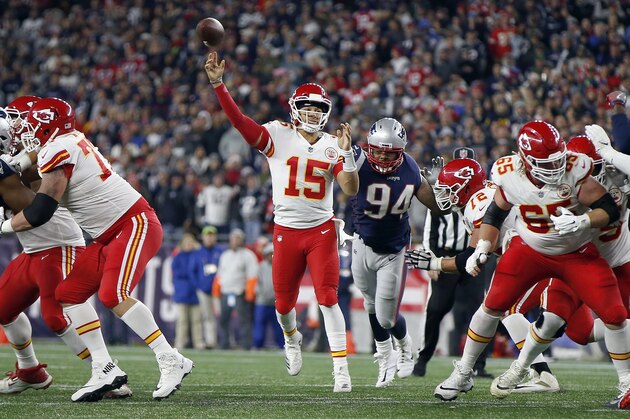 Kansas City Chiefs quarterback Patrick Mahomes (15) throws a touchdown pass to wide receiver Tyreek Hill (10) during the second half of an NFL football game against the New England Patriots, Sunday, Oct. 14, 2018, in Foxborough, Mass. (AP Photo/Michael Dwyer)