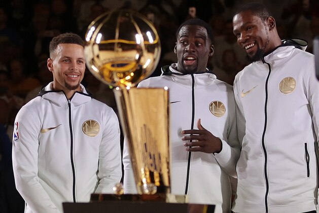 From left, Golden State Warriors' Shaun Livingston, Stephen Curry, Draymond Green, and Kevin Durant wait for their NBA championship rings during a ring ceremony prior to the basketball game against the Houston Rockets Tuesday, Oct. 17, 2017, in Oakland, Calif. (AP Photo/Ben Margot)