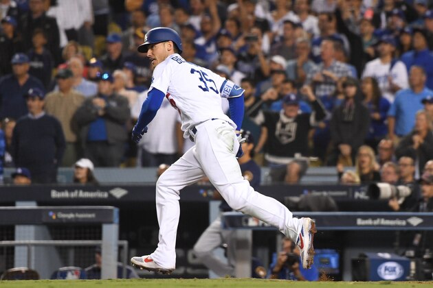 LOS ANGELES, CA - OCTOBER 16:  Cody Bellinger #35 of the Los Angeles Dodgers singles against the Milwaukee Brewers in Game Four of the National League Championship Series at Dodger Stadium on October 16, 2018 in Los Angeles, California.  (Photo by Harry How/Getty Images)