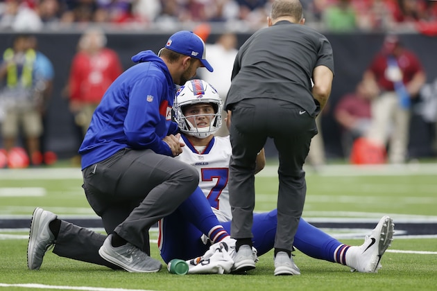 HOUSTON, TX - OCTOBER 14:  Josh Allen #17 of the Buffalo Bills is tended to by the training staff in the second half against the Houston Texans at NRG Stadium on October 14, 2018 in Houston, Texas.  (Photo by Tim Warner/Getty Images)