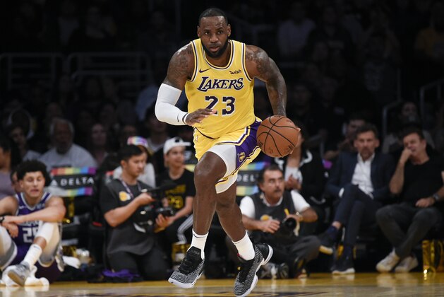 Los Angeles Lakers forward LeBron James moves the ball up court during the first half of an NBA preseason basketball game against the Sacramento Kings in Los Angeles, Thursday, Oct. 4, 2018. (AP Photo/Kelvin Kuo)