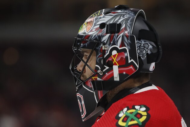 Chicago Blackhawks' Corey Crawford warms up before an NHL hockey game against the Dallas Stars Thursday, Nov. 30, 2017, in Chicago. (AP Photo/Jim Young)