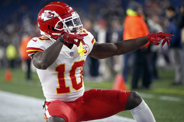 Kansas City Chiefs wide receiver Tyreek Hill strikes a pose as he warms up before an NFL football game, Sunday against the New England Patriots, Oct. 14, 2018, in Foxborough, Mass. (AP Photo/Michael Dwyer)
